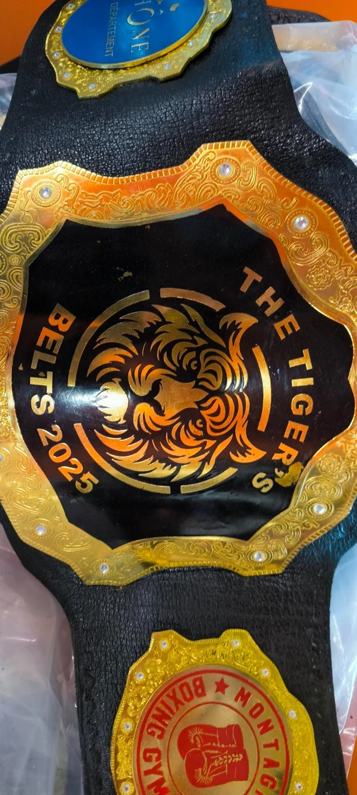 Gold main plate and black leather detail