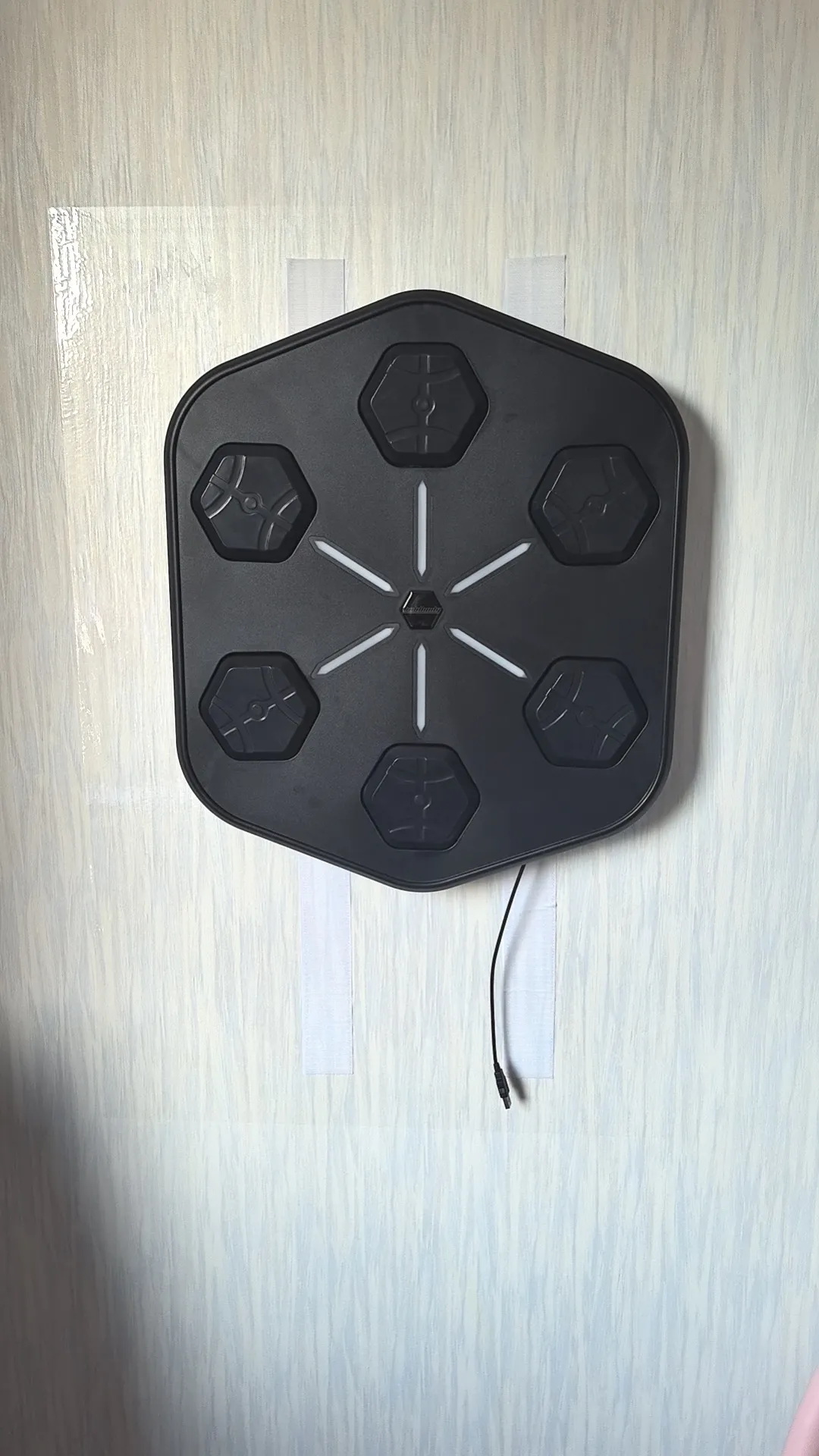 Smart boxing machine mounted on a wall