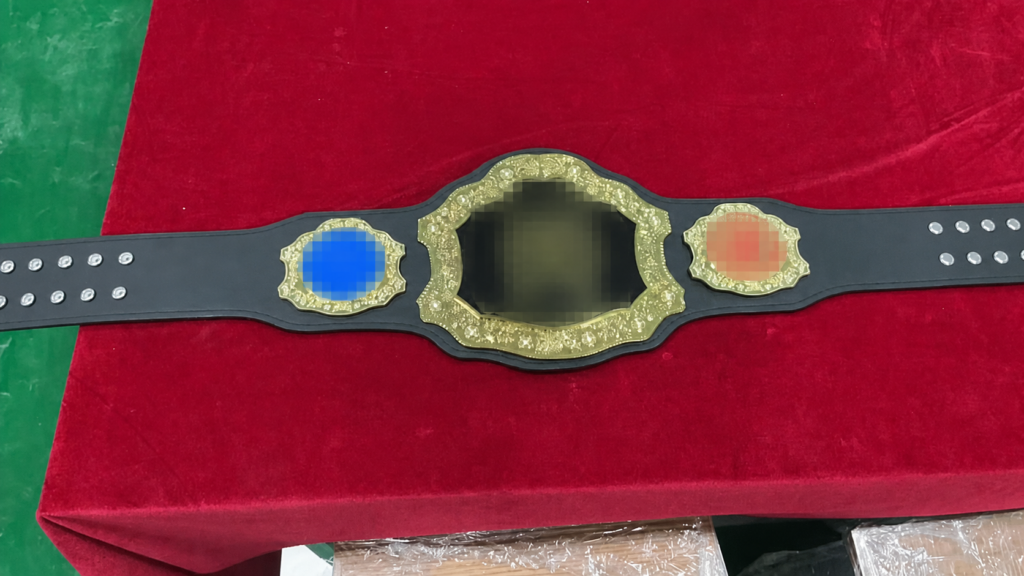 Finished-belt detail used to compare visible finish and plate execution against the approved design